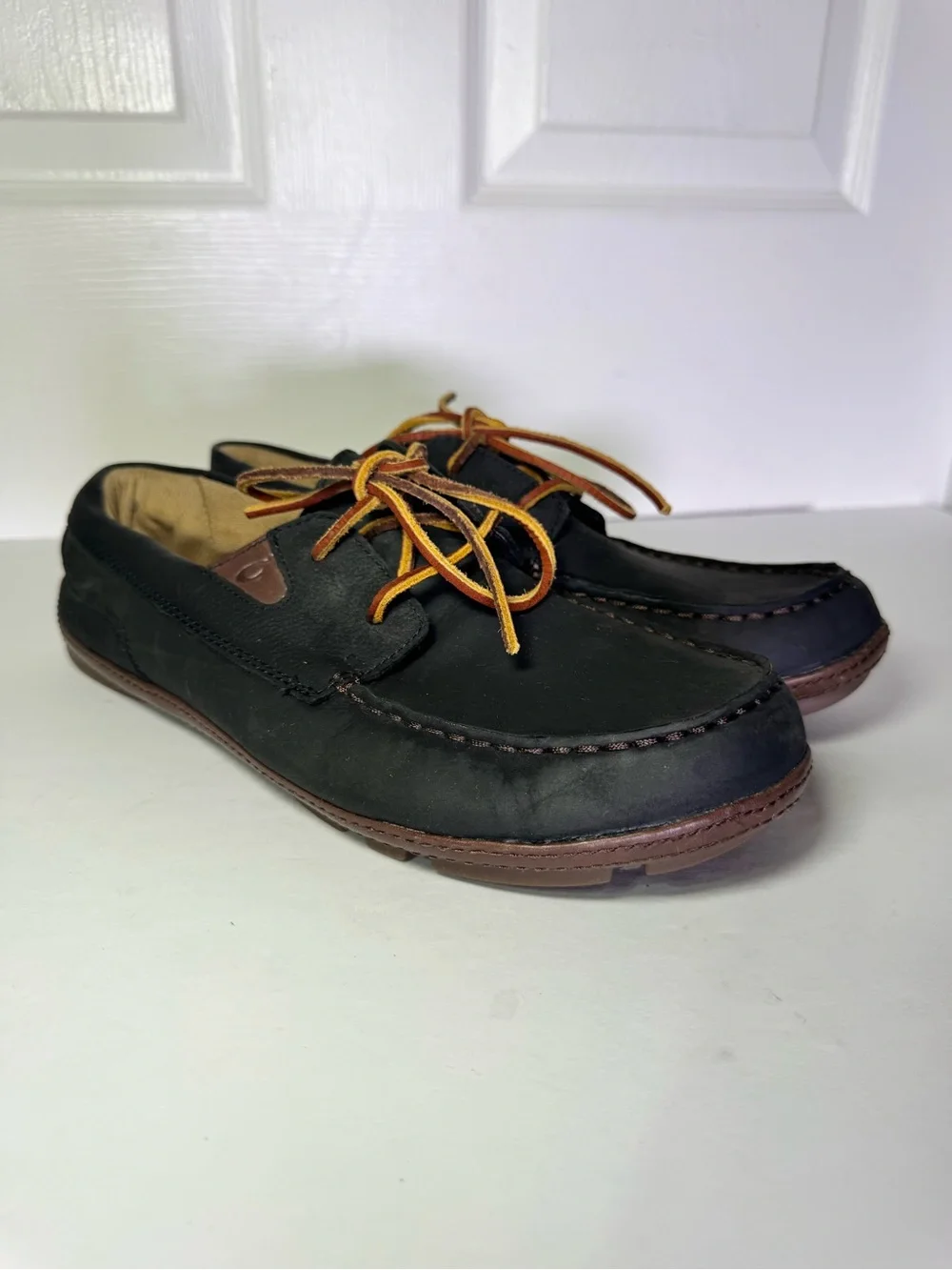 OluKai Black and Brown Leather Boat Moccasins with Tan Laces